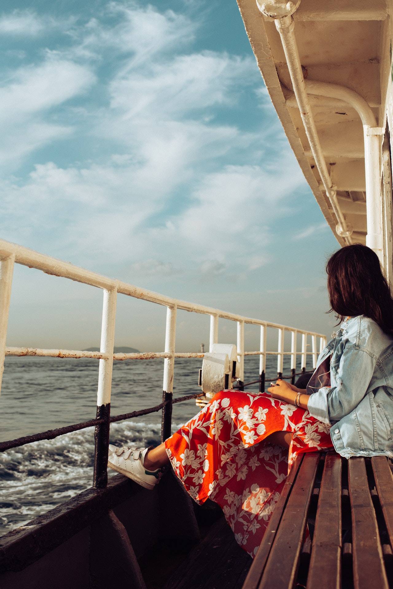 Lady sitting on the side of a boat - darren yaw malaysia