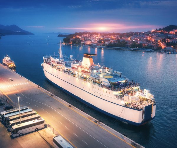 Aerial view of cruise ship at harbor at sunset