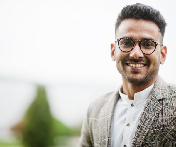 Stylish pakistani man wear in eyeglasses and jacket.